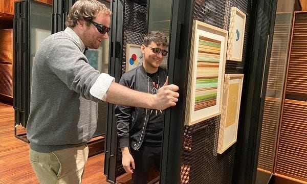 Two visitors at MCA Denver look at exhibit